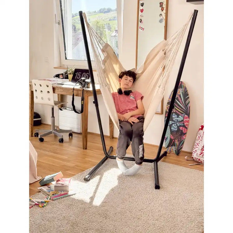 Fiji Organic Latte – Organic Cotton Comfort Size Hammock Chair with Galvanized Steel Stand – teen resting in the Latte chair beside a bedroom desk