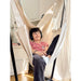 Fiji Organic Latte – Organic Cotton Comfort Size Hammock Chair with Galvanized Steel Stand – close view of a teen wearing headphones in the Latte hammock chair