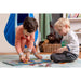 LA SIESTA Joki Dolphy Kids Hanging Nest – kids doing a puzzle beside the hanging nest