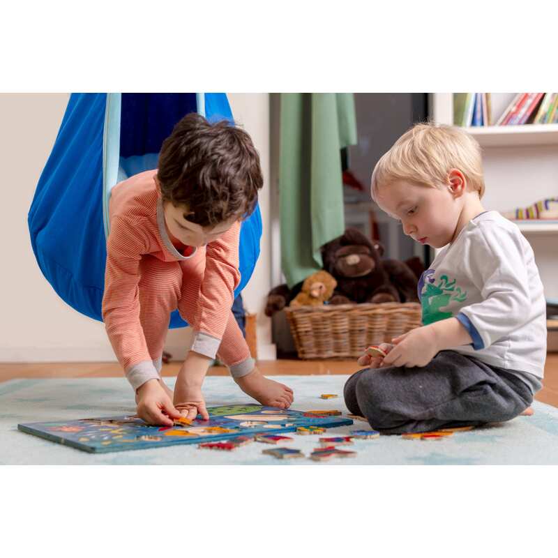 LA SIESTA Joki Dolphy Kids Hanging Nest – kids doing a puzzle beside the hanging nest