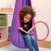 LA SIESTA Joki Lilly Kids Hanging Nest – kid reading in a pink and purple hanging nest