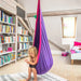LA SIESTA Joki Lilly Kids Hanging Nest – kid seated forward in a reading corner