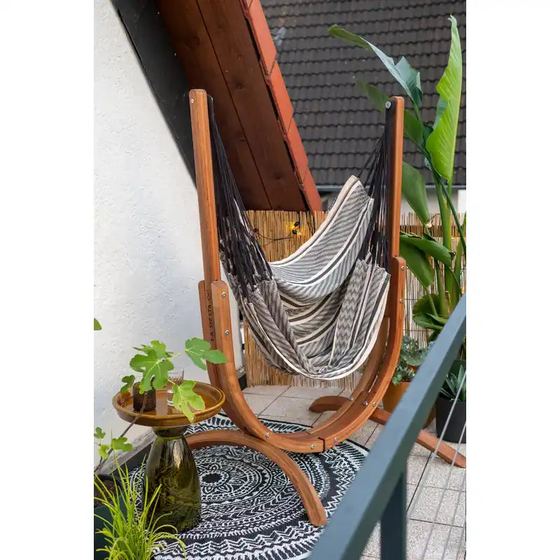 Udine Organic Zebra - Organic Cotton Hammock Chair with FSC® certified Eucalyptus Stand – chair in a leafy covered corner