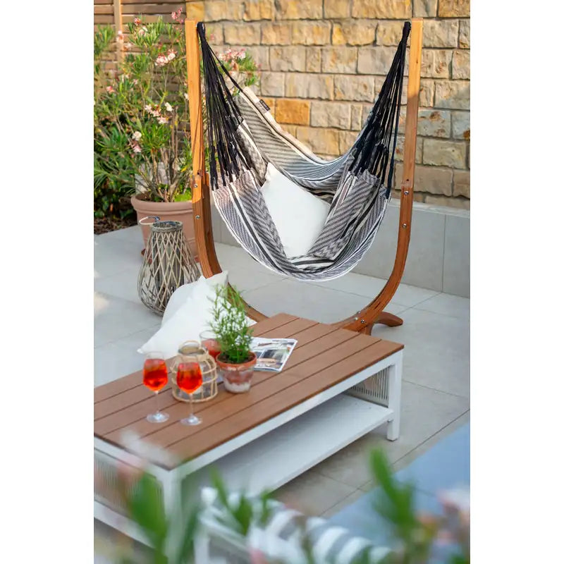 Udine Organic Zebra - Organic Cotton Hammock Chair with FSC® certified Eucalyptus Stand – chair on a stone patio