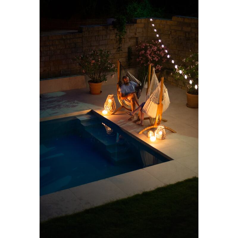 Udine Organic Zebra - Organic Cotton Hammock Chair with FSC® certified Eucalyptus Stand – chairs beside an illuminated pool