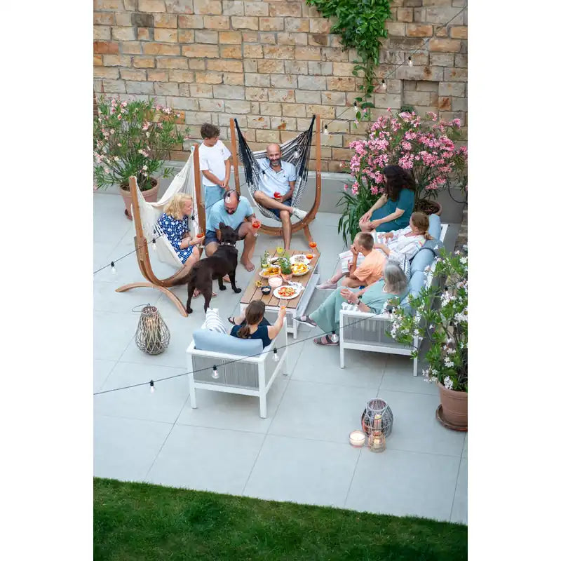Udine Organic Zebra - Organic Cotton Hammock Chair with FSC® certified Eucalyptus Stand – group relaxing on a patio
