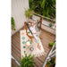 Udine Organic Zebra - Organic Cotton Hammock Chair with FSC® certified Eucalyptus Stand – person seated on a balcony