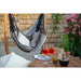 Udine Organic Zebra - Organic Cotton Hammock Chair with FSC® certified Eucalyptus Stand – zebra chair beside an outdoor table