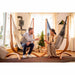 Udine Organic Latte - Organic Cotton Hammock Chair with FSC® certified Eucalyptus Stand – adults seated in a family room