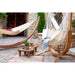 Udine Organic Latte - Organic Cotton Hammock Chair with FSC® certified Eucalyptus Stand – chair and hammock in a courtyard