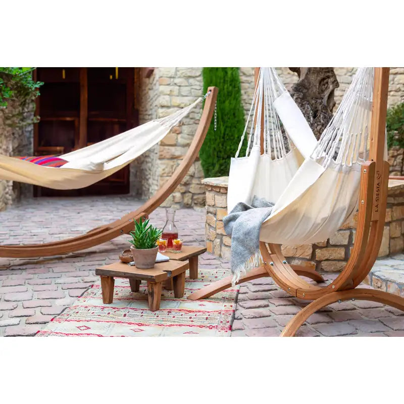 Udine Organic Latte - Organic Cotton Hammock Chair with FSC® certified Eucalyptus Stand – chair and hammock in a courtyard