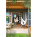 Udine Organic Latte - Organic Cotton Hammock Chair with FSC® certified Eucalyptus Stand – chair beside a sheltered porch