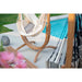 Udine Organic Latte - Organic Cotton Hammock Chair with FSC® certified Eucalyptus Stand – empty chair beside pool greenery