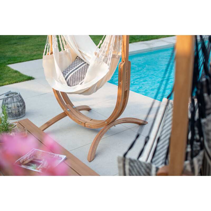 Udine Organic Latte - Organic Cotton Hammock Chair with FSC® certified Eucalyptus Stand – empty chair beside pool greenery