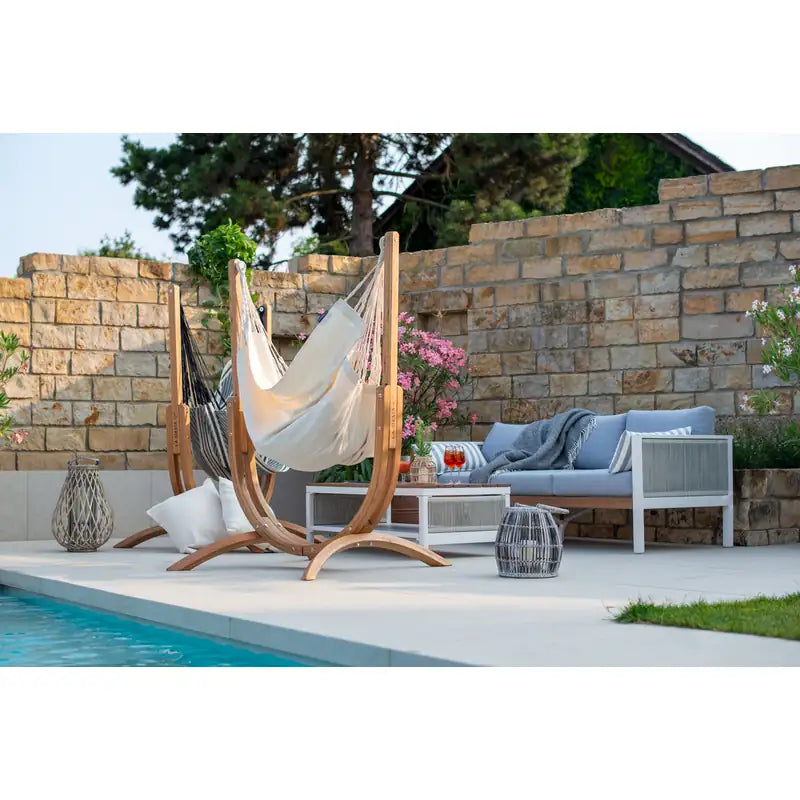 Udine Organic Latte - Organic Cotton Hammock Chair with FSC® certified Eucalyptus Stand – empty chair on a stone patio