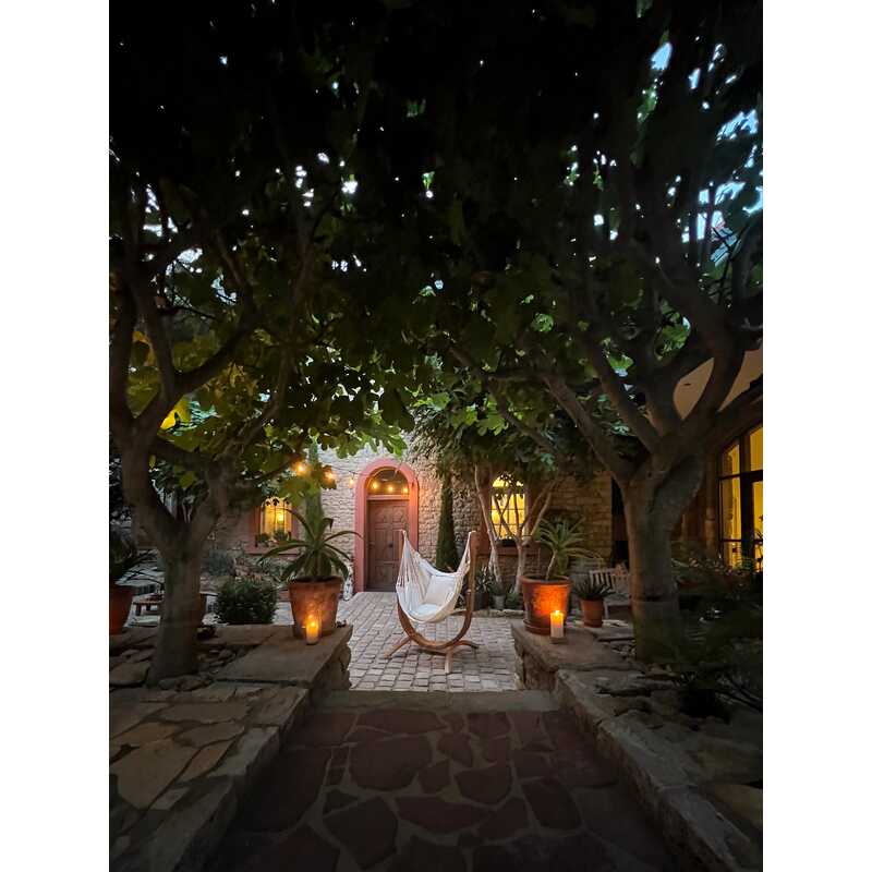 Udine Organic Latte - Organic Cotton Hammock Chair with FSC® certified Eucalyptus Stand – evening courtyard scene