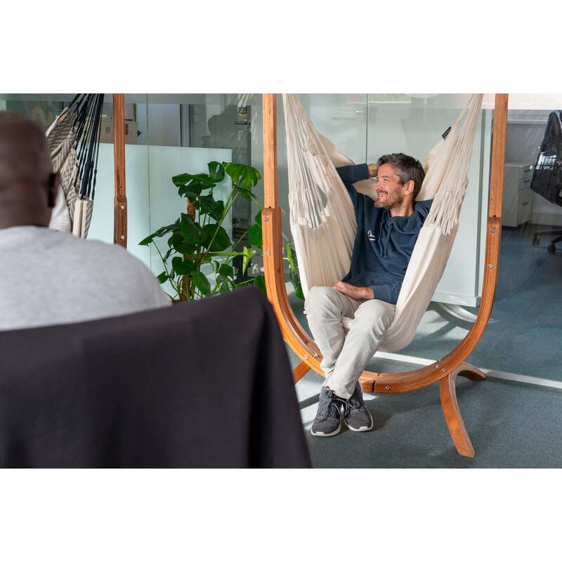 Udine Organic Latte - Organic Cotton Hammock Chair with FSC® certified Eucalyptus Stand – person seated in a home workspace