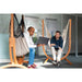 Udine Organic Latte - Organic Cotton Hammock Chair with FSC® certified Eucalyptus Stand – two people sharing a laptop nearby