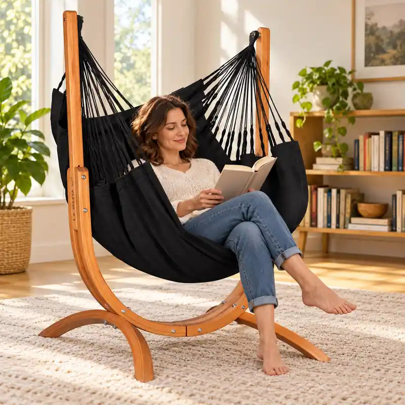 Udine Organic Onyx - Organic Cotton Hammock Chair with FSC® certified Eucalyptus Stand – lifestyle illustration of adult reading in the hammock chair in a family reading room