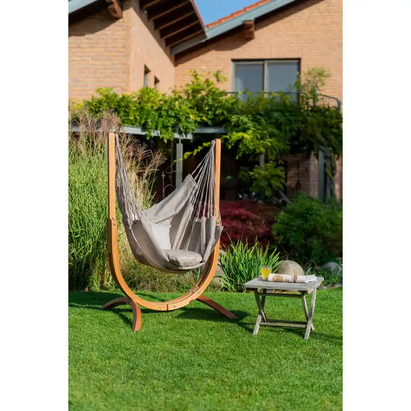 Udine Outdoor Almond - Weather-Resistant Hammock Chair with FSC® certified Eucalyptus Stand – chair beside a house and garden