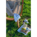 Udine Outdoor Almond - Weather-Resistant Hammock Chair with FSC® certified Eucalyptus Stand – chair beside an outdoor picnic