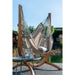 Udine Outdoor Almond - Weather-Resistant Hammock Chair with FSC® certified Eucalyptus Stand – chair beside an outdoor table