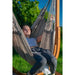 Udine Outdoor Almond - Weather-Resistant Hammock Chair with FSC® certified Eucalyptus Stand – close view of a reclining person
