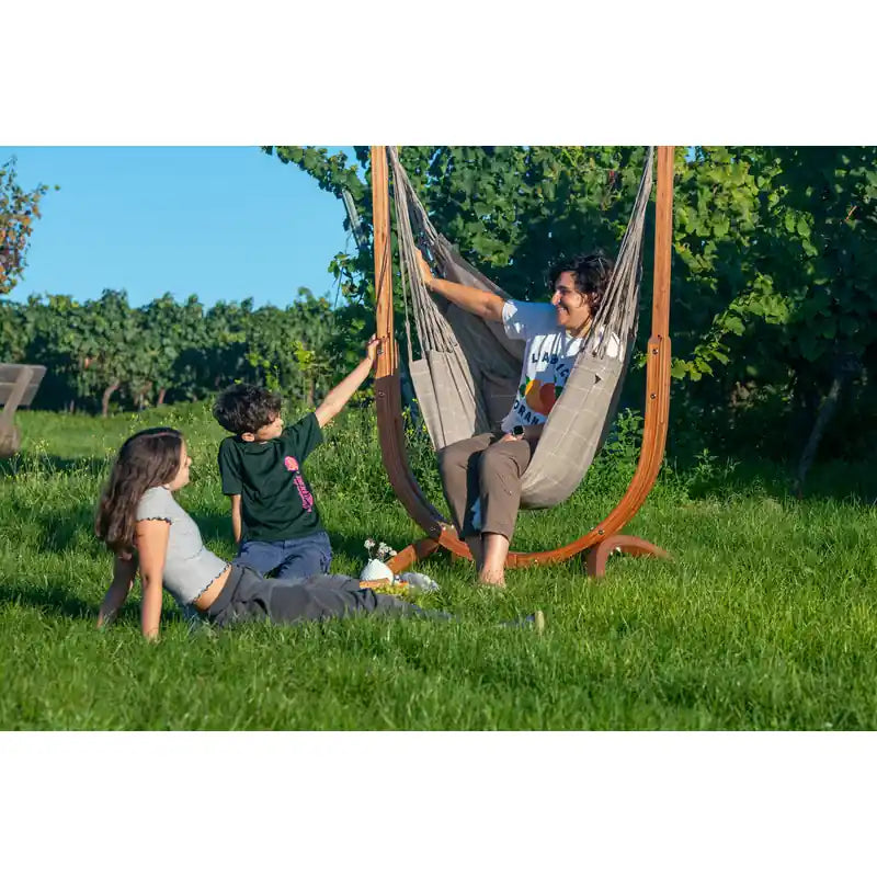 Udine Outdoor Almond - Weather-Resistant Hammock Chair with FSC® certified Eucalyptus Stand – friends relaxing beside the chair