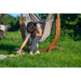 Udine Outdoor Almond - Weather-Resistant Hammock Chair with FSC® certified Eucalyptus Stand – person reaching from the chair toward a picnic