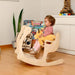Little Girl Sitting on a Kidodido Toddler Furniture Set Rocking Chair and Table