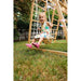magnolia_outdoor_and_indoor_real_wood_7_in_1_playset_girl_on_swing_smiling