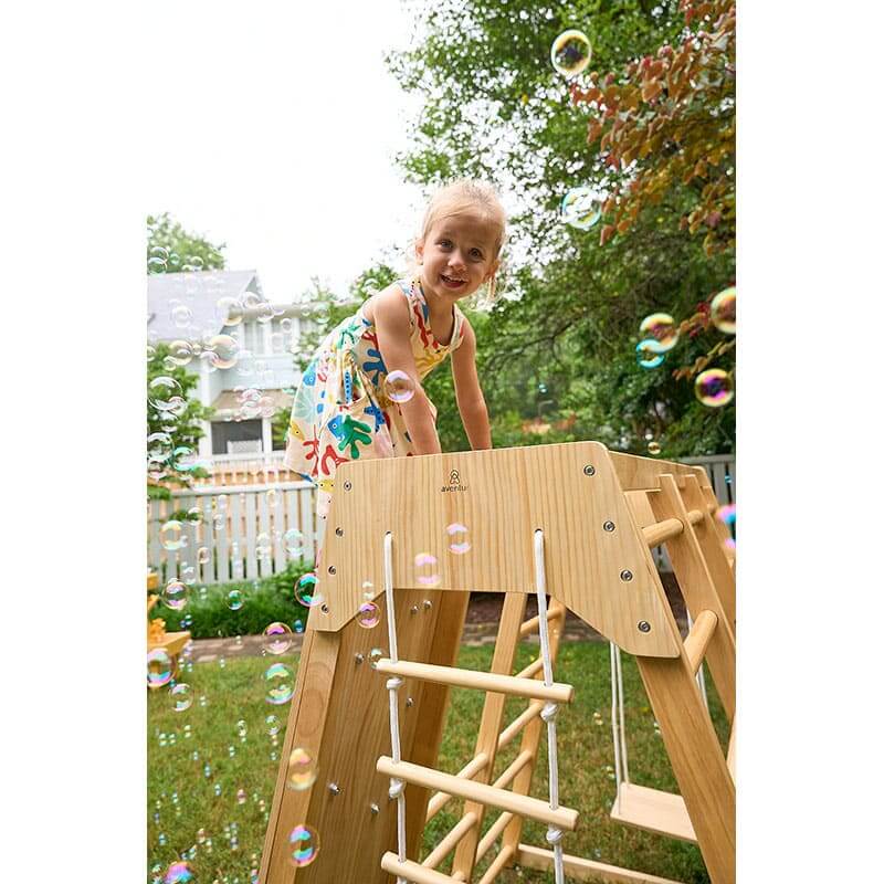 magnolia_outdoor_and_indoor_real_wood_7_in_1_playset_girl_on_top_close_up