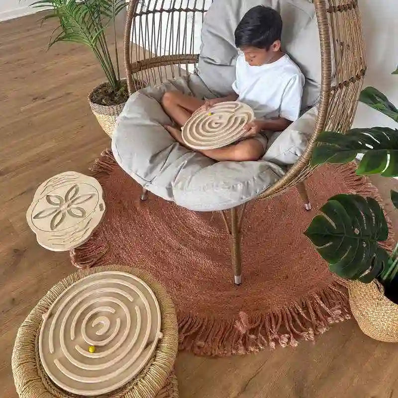 Boy balancing on the Mira Balance Board indoors