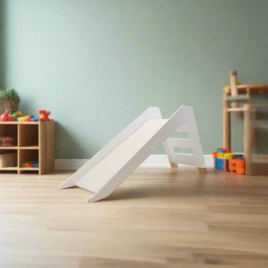 modern white indoor slide in a playroom