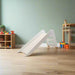 modern white indoor slide in a playroom