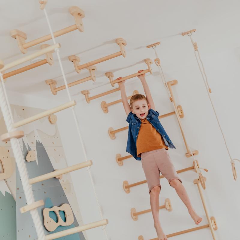 Monkey Bars Kit – kid hanging from ceiling-mounted bars
