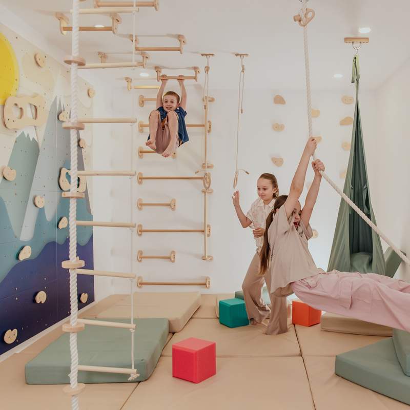 Monkey Bars Kit – kids using a playroom with overhead bars