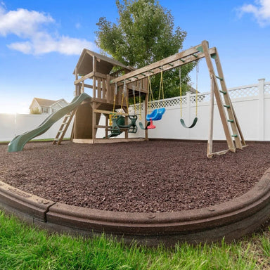 Playsafer Rubber Playground Mulch in Cocoa Brown beneath a backyard jungle gym