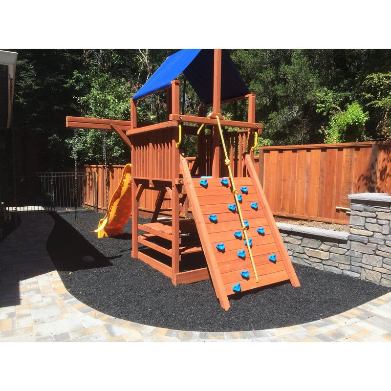 Playsafer Rubber Playground Mulch in Painted Black beneath a backyard jungle gym