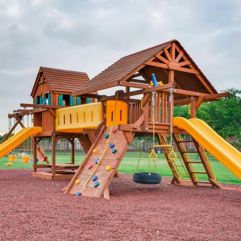 Playsafer Rubber Playground Mulch in Terra Cotta beneath a wood playset