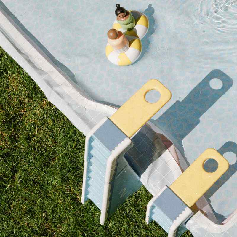 Smol Pool Day Water Table low diving platforms and mini figures beside the pool