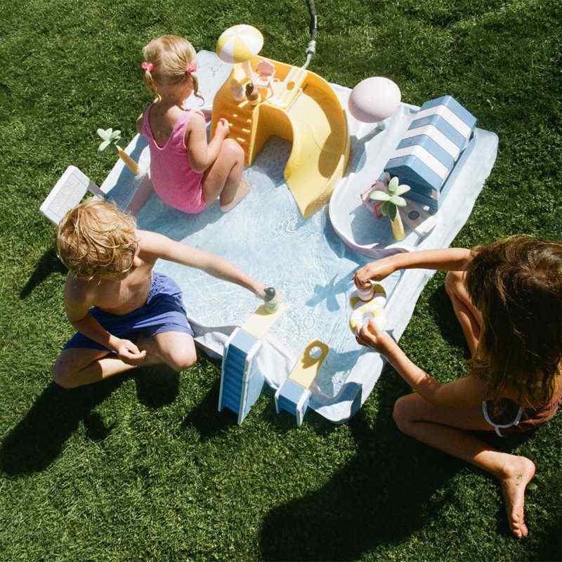 Smol Pool Day Water Table with waterslide, diving platforms, umbrellas, palm trees, and mini figures
