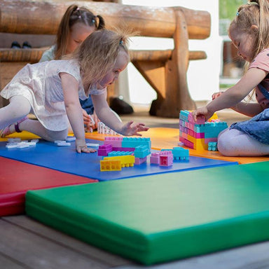 Foam play mat set in multi colors withs girls playing 