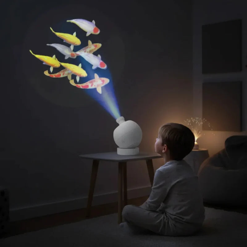 Sensory Vista Pro Projector with Speakers & 8 Image Discs - child watching projected fish above the projector