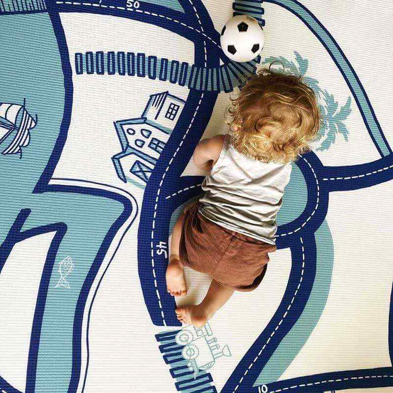 The Bowie Shwally Playmat reverse side with baby playing