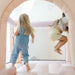 Smol Rainbow Pink Bounce House set up indoors for active play