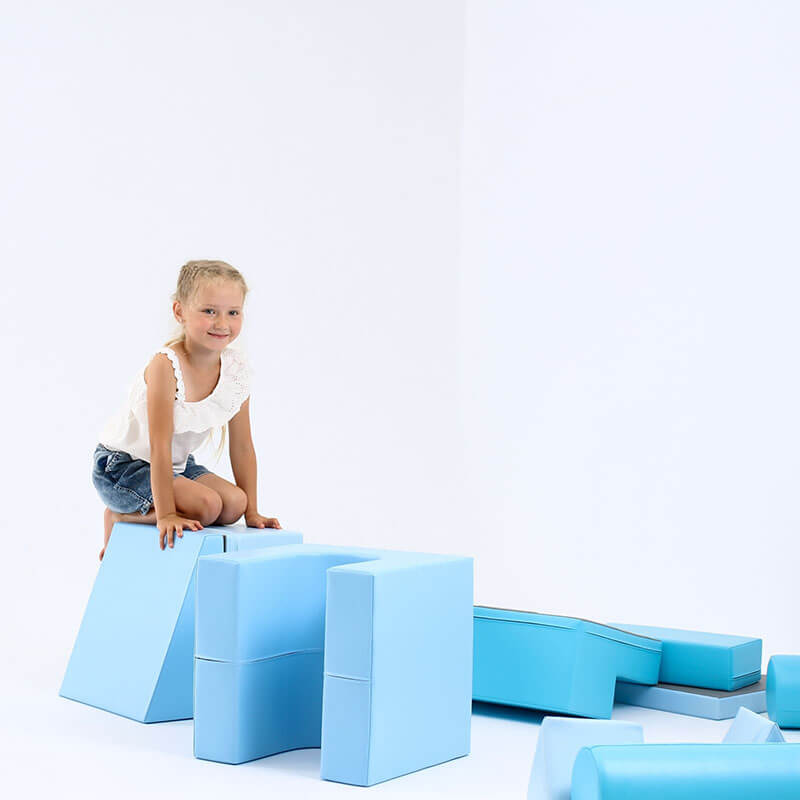 soft_play_set_castle_blue_girl_kneeling_on_blocks