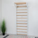 Swedish Wall Ladder – White and natural wood wall bars viewed from the front