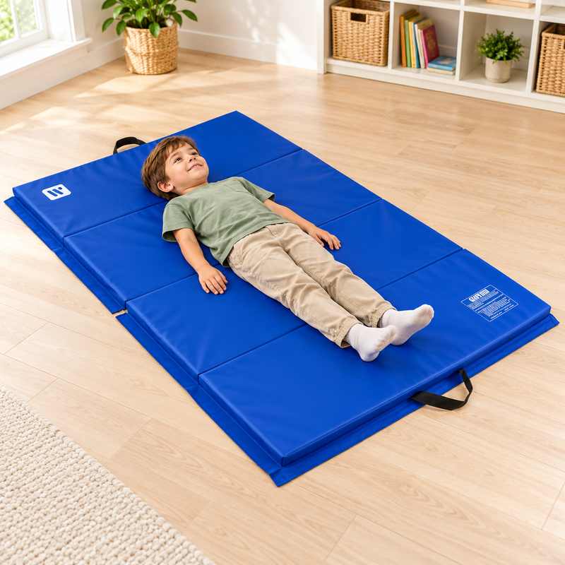 TFH Folding Mat 4' x 6' Blue with a child resting on the open four-panel mat in a bright playroom.