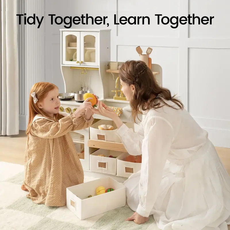 Tiny Land® Wooden Play Kitchen with Storage for Creative Toddlers – Parent and child putting play food away at the Cream kitchen